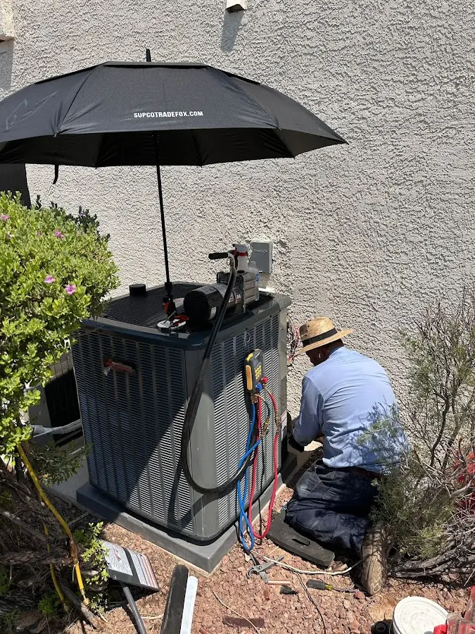 HVAC technician performing outdoor AC maintenance in Bolingbrook